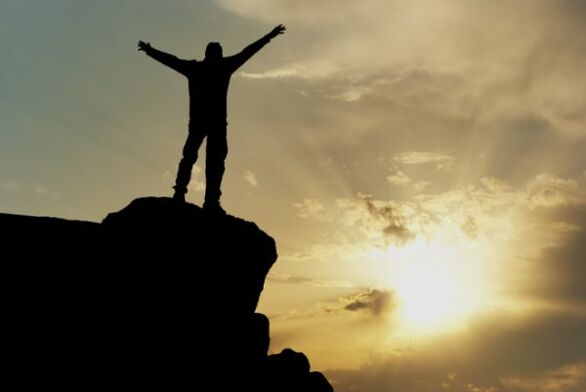 The person on the top of the mountain